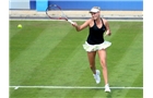 BIRMINGHAM, ENGLAND - JUNE 09:  Donna Vekic of Croatia returns a shot from Belinda Bencic of Switzerland on day one of the AEGON Classic Tennis Tournament at Edgbaston Priory Club on June 9, 2014 in Birmingham, England.  (Photo by Tom Dulat/Getty Images)